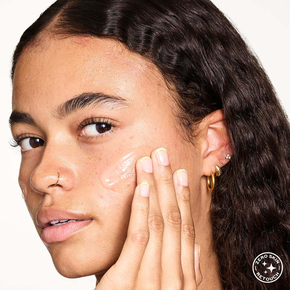 A photo of model using a face serum